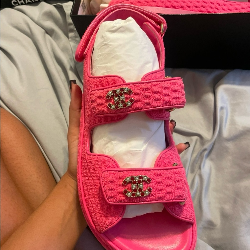 CHANEL Pink Sandals with Textured Straps and Metallic Emblem